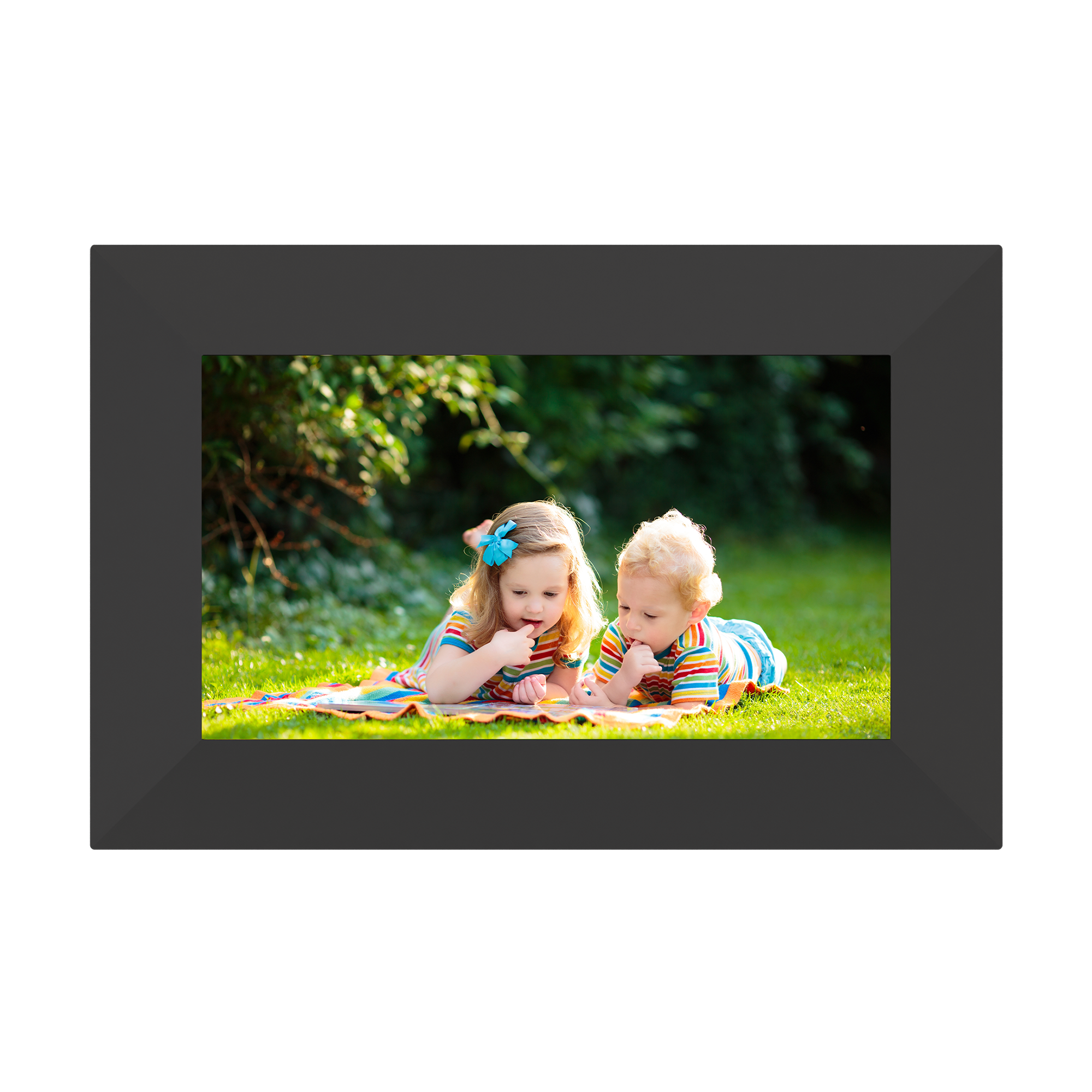 Digital photo frame displaying two children on a grassy field