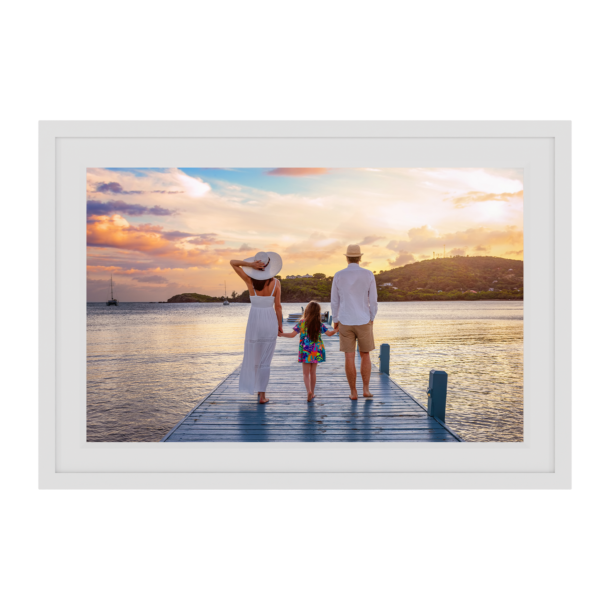 Framed photograph of a family on a dock at sunset.