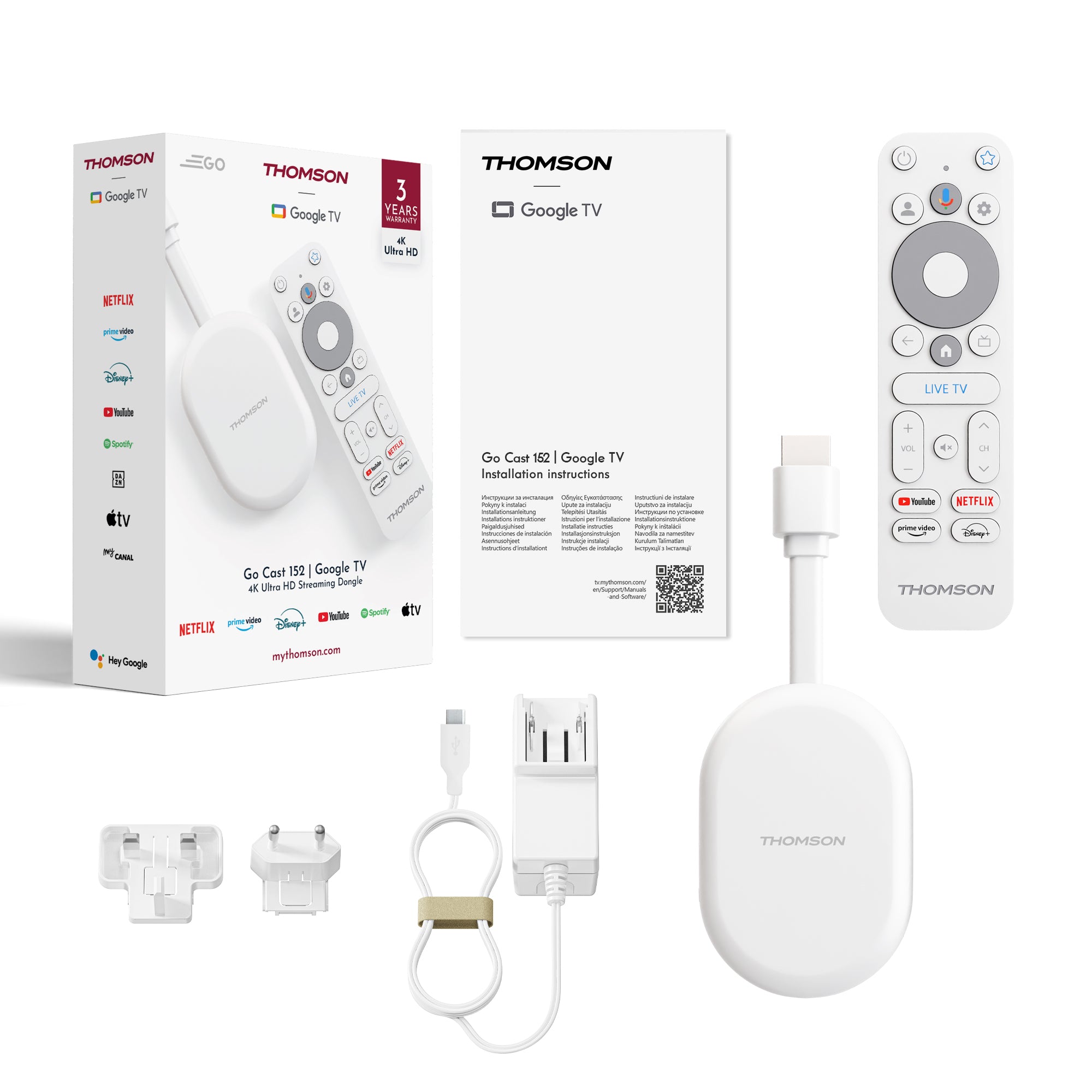Thomson Google TV streaming device with packaging, remote control, and accessories on a white background