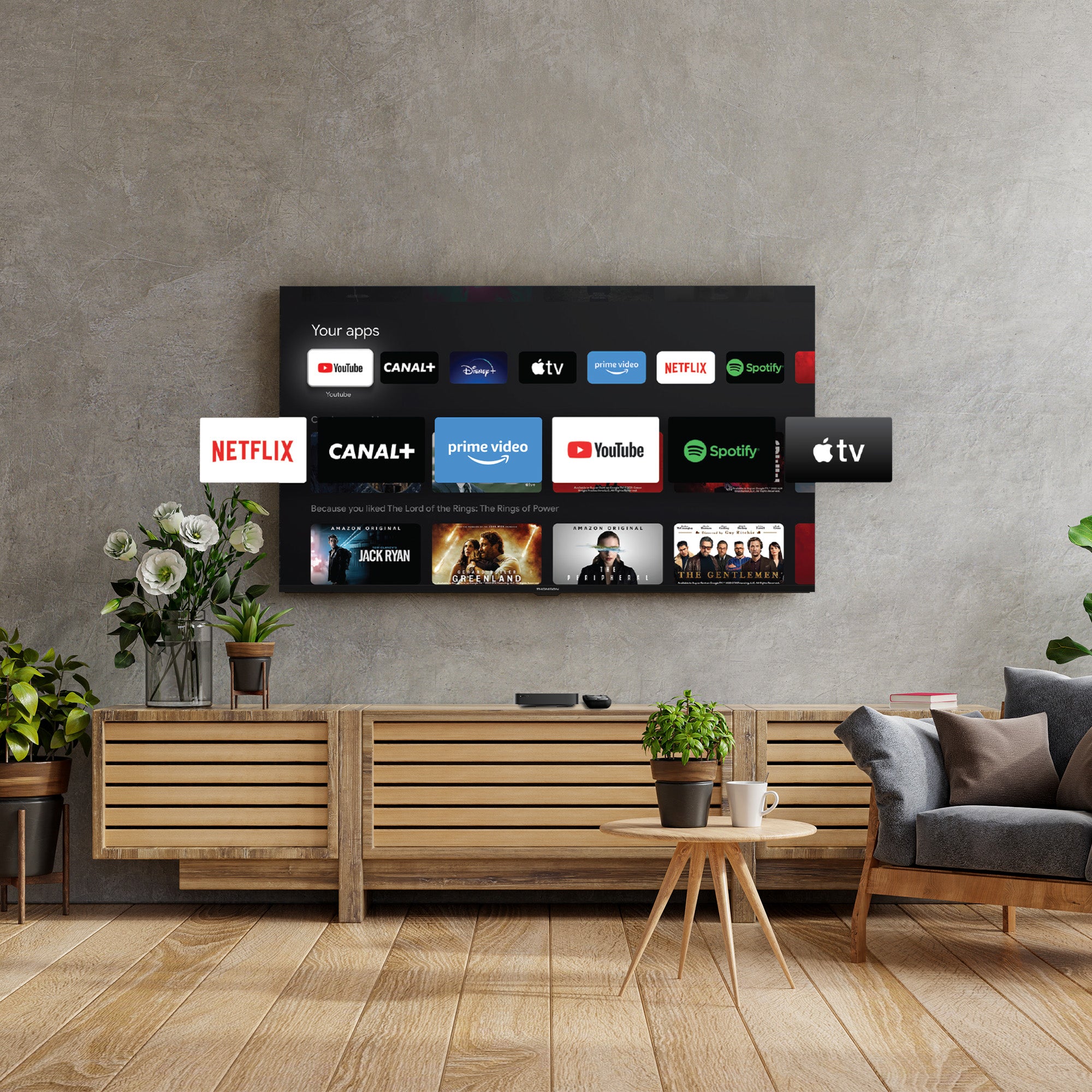 Living room with a wall-mounted TV displaying various streaming app logos.