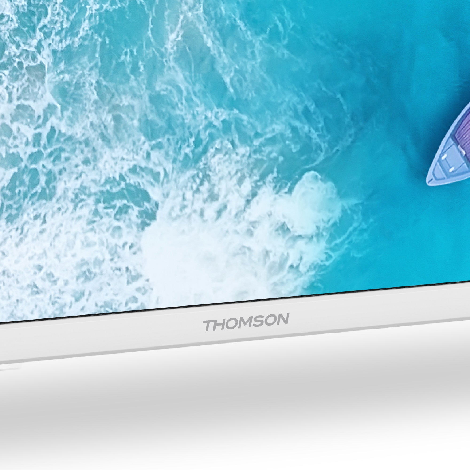 Close-up of a Thomson electronic device with a blue screen displaying water.