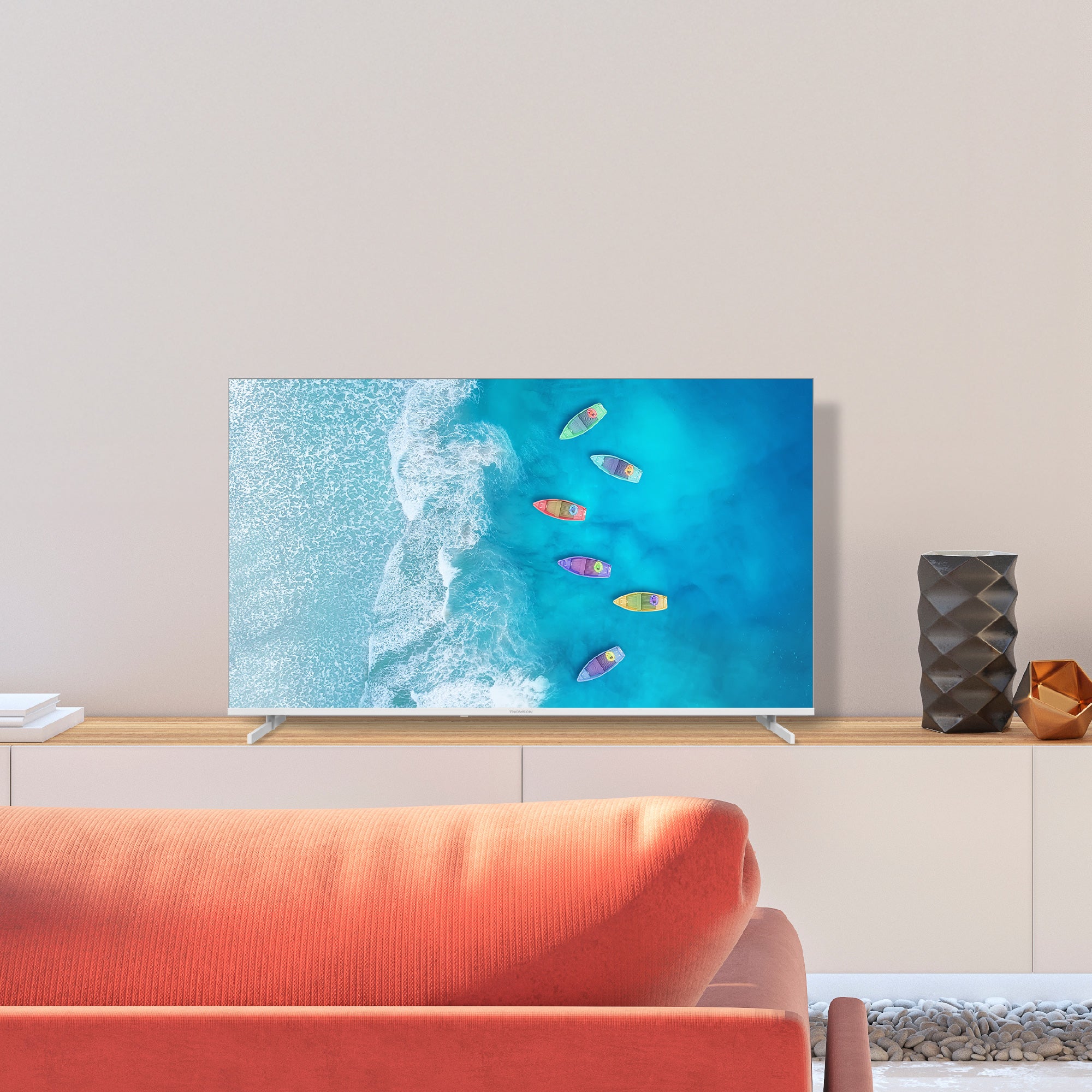 TV displaying a beach scene with colorful boats in a modern living room.