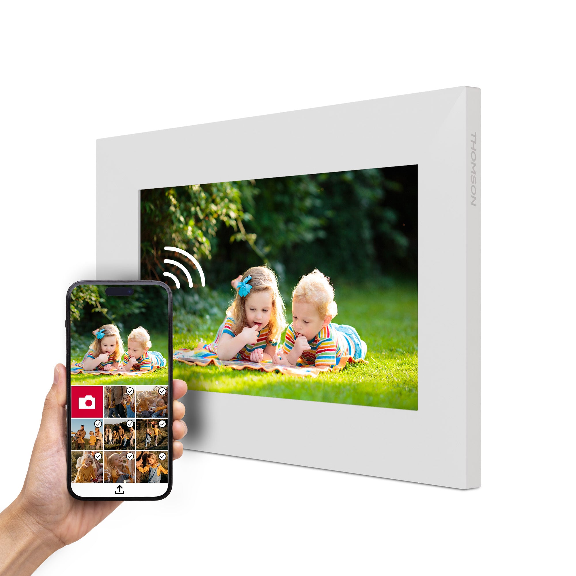 Digital photo frame displaying children playing outdoors, with a smartphone showing photo selection.