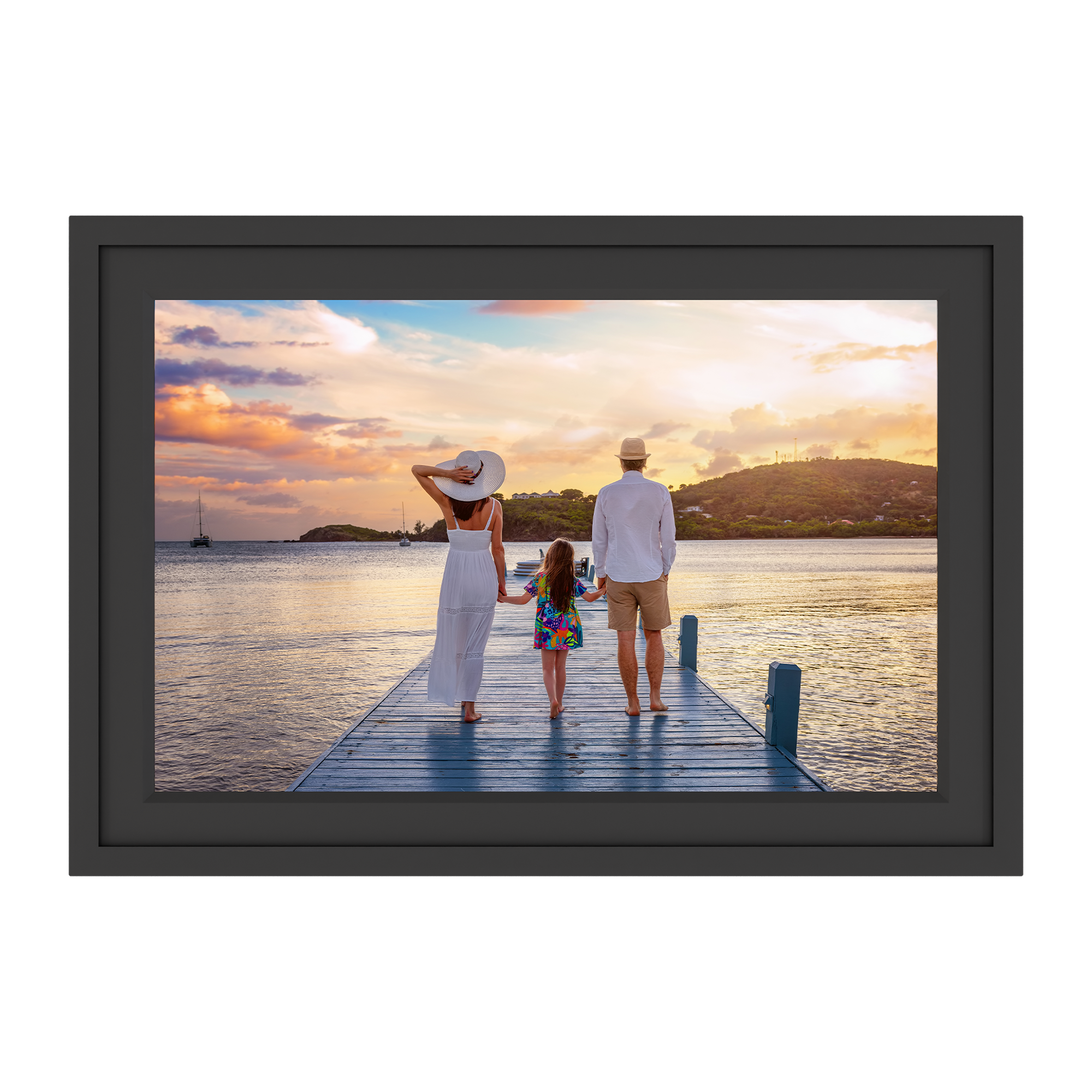 Framed photograph of a family on a dock at sunset.