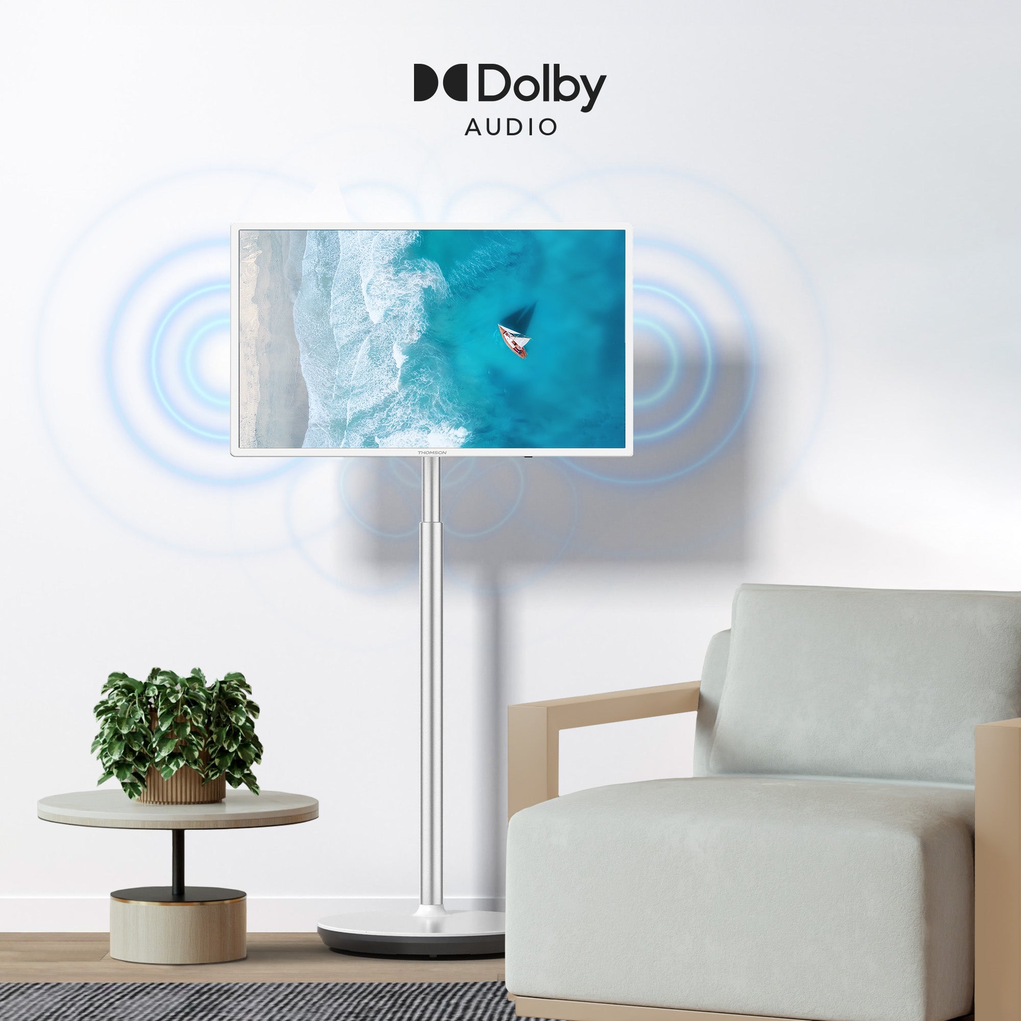 Living room with Dolby Audio setup, showing a portable TV screen with an ocean scene.