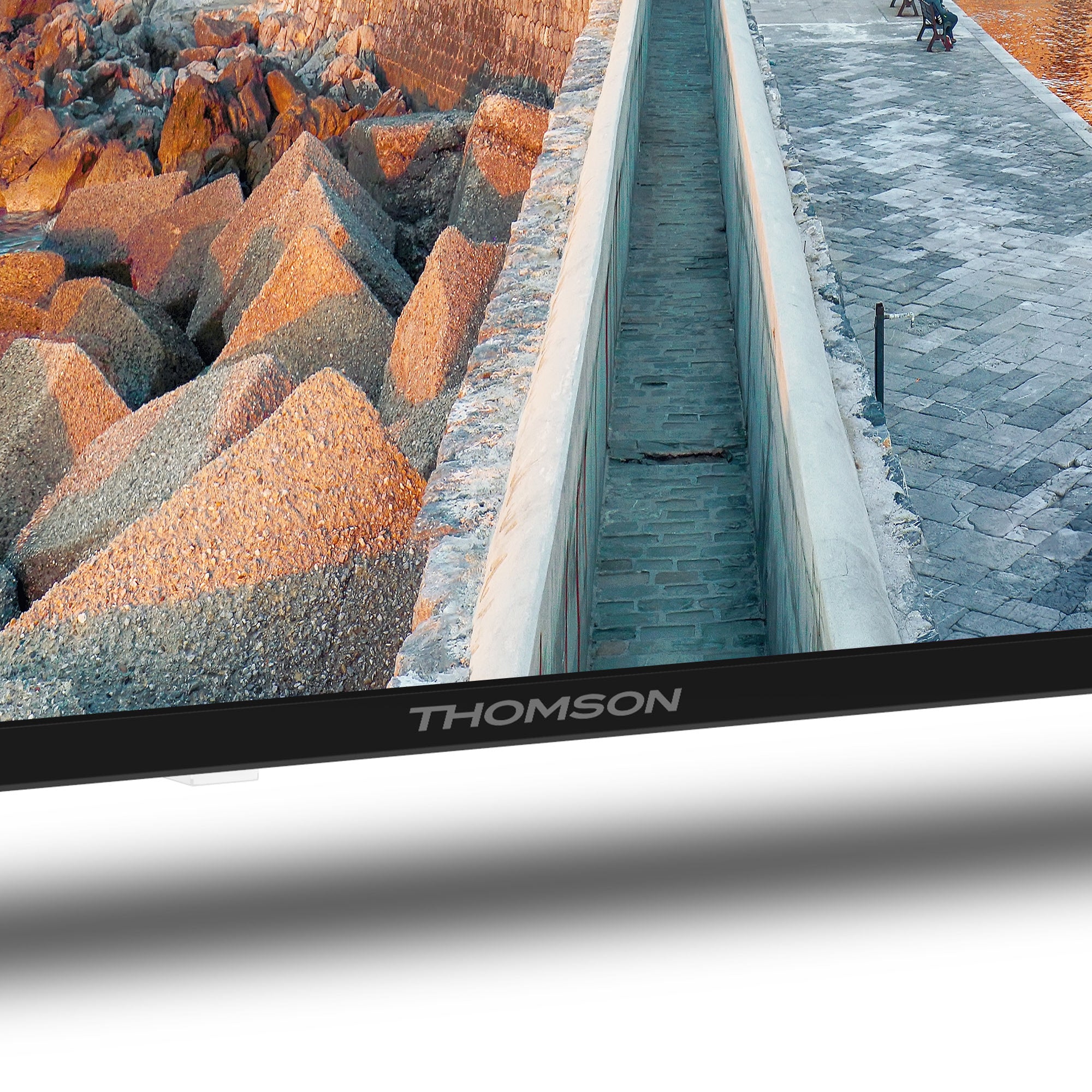 Thomson TV screen displaying a scenic view with rocks and water.