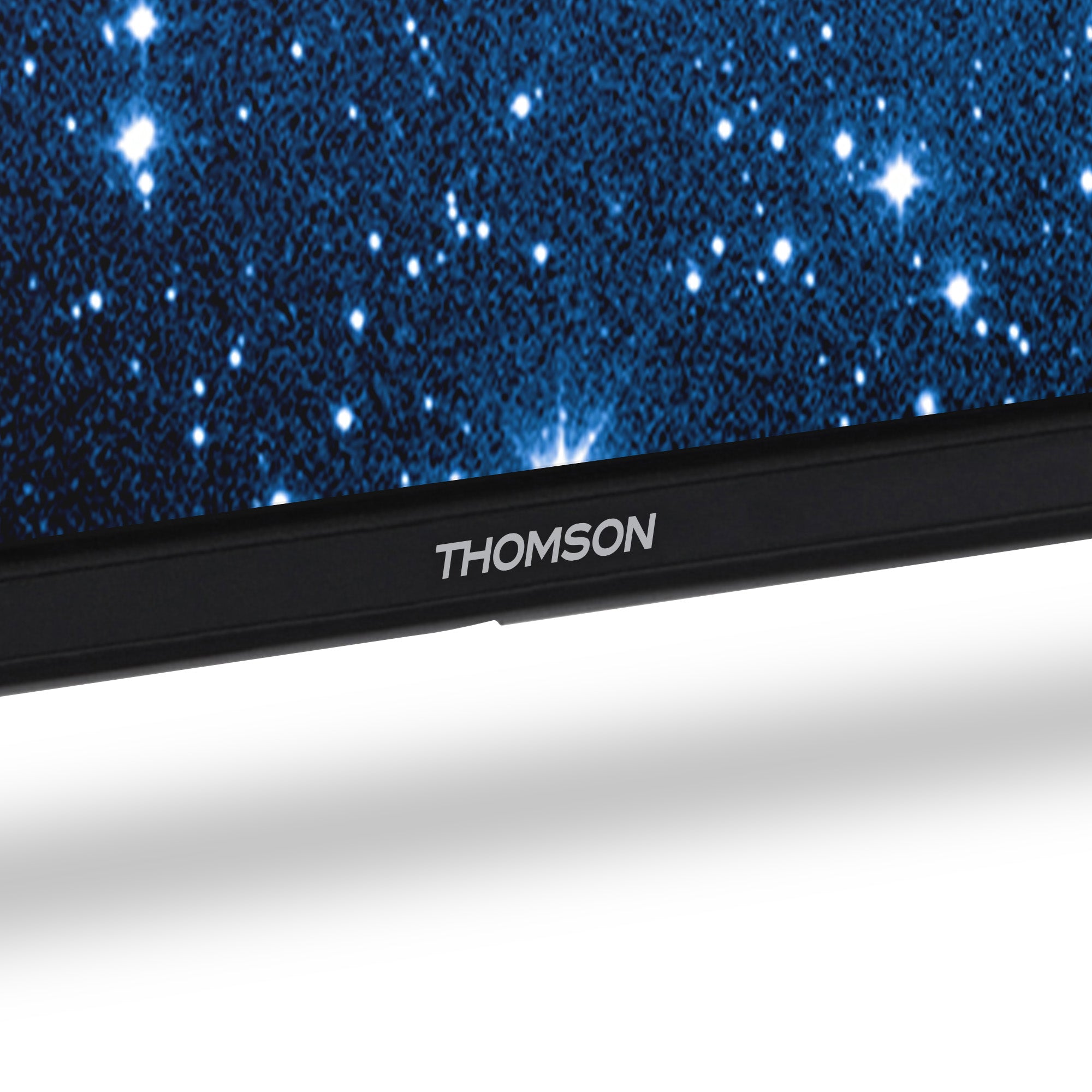Close-up of a Thomson TV screen displaying a starry night sky image.