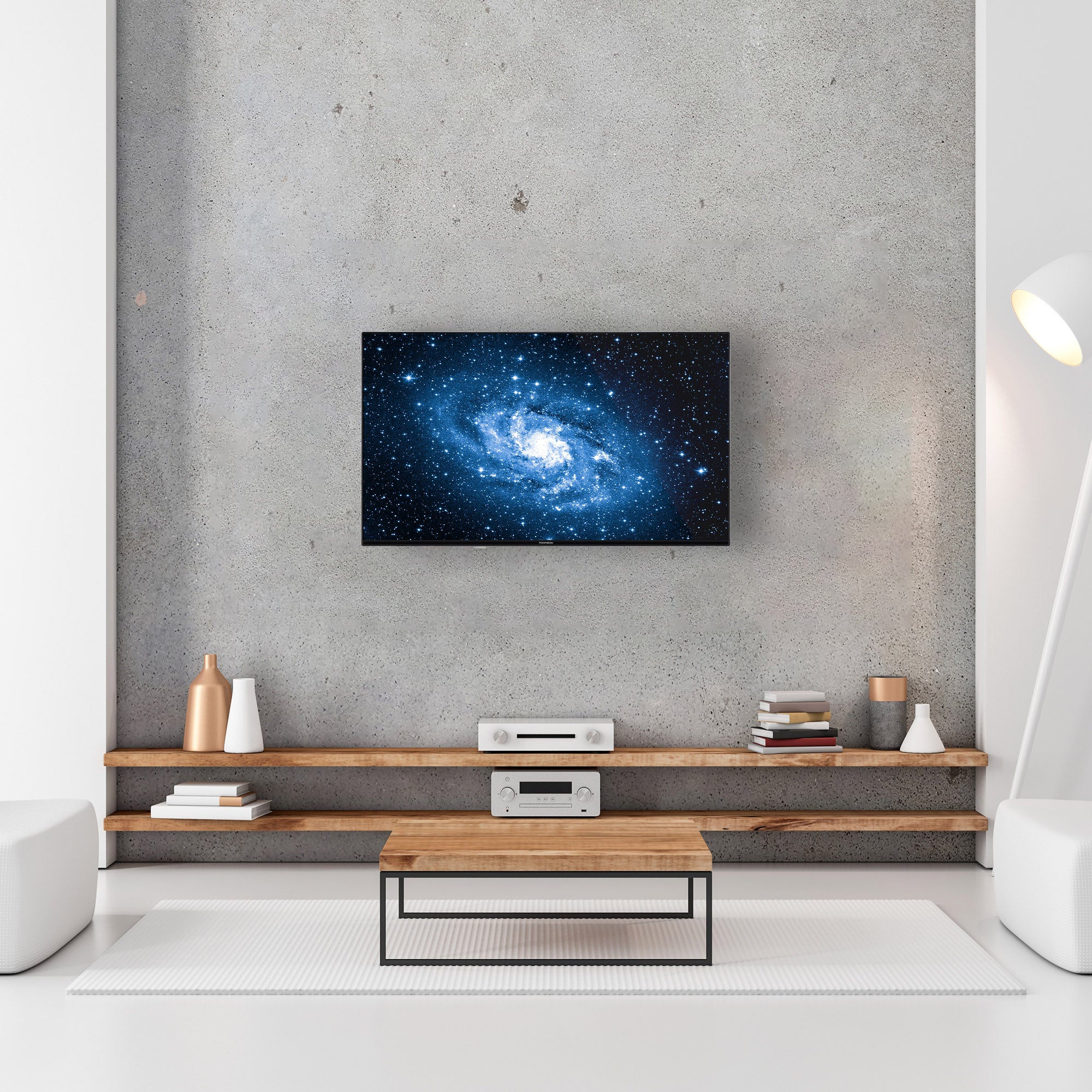 Modern living room with a TV displaying a galaxy image on a concrete wall.