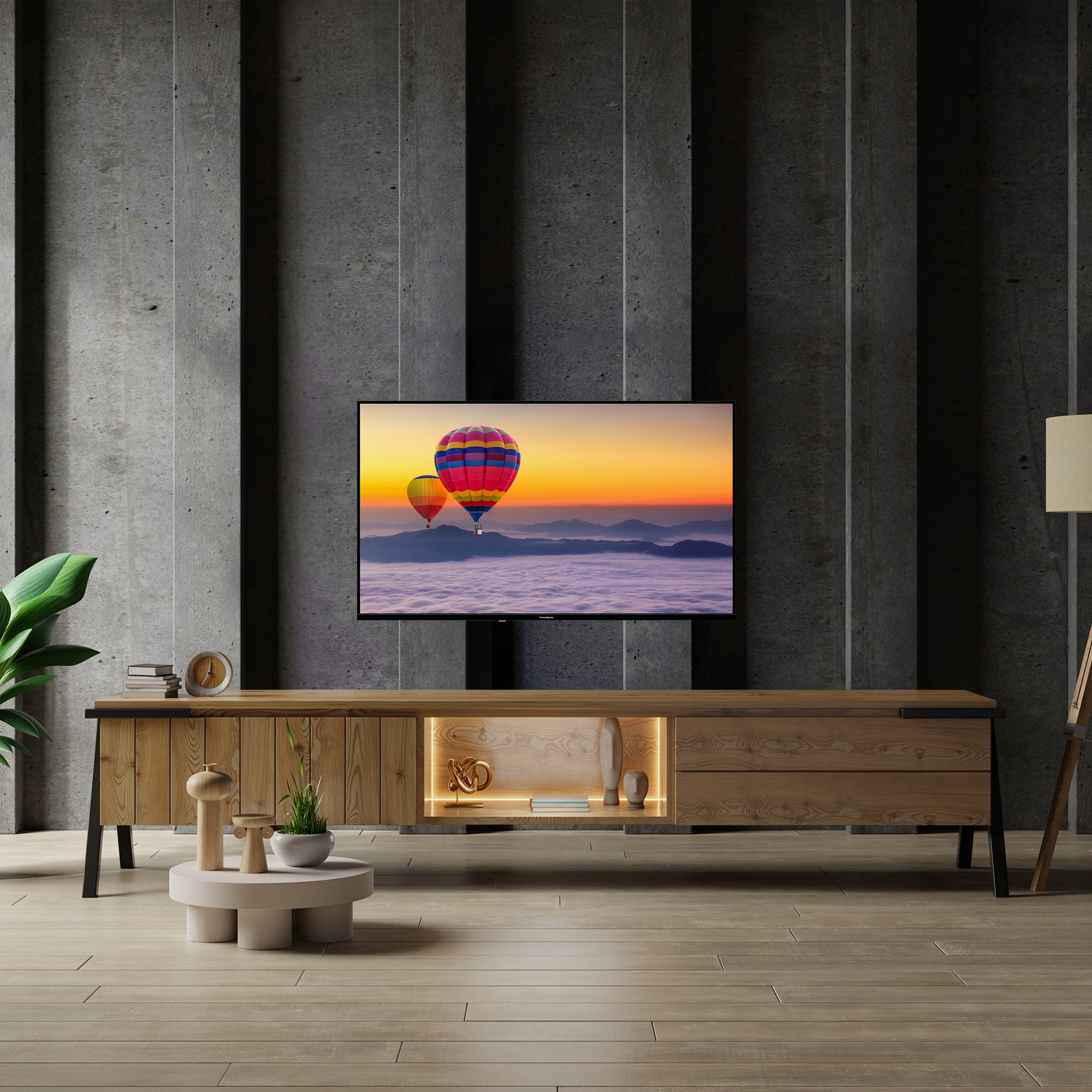 Modern living room with a wooden TV stand and a television displaying hot air balloons.