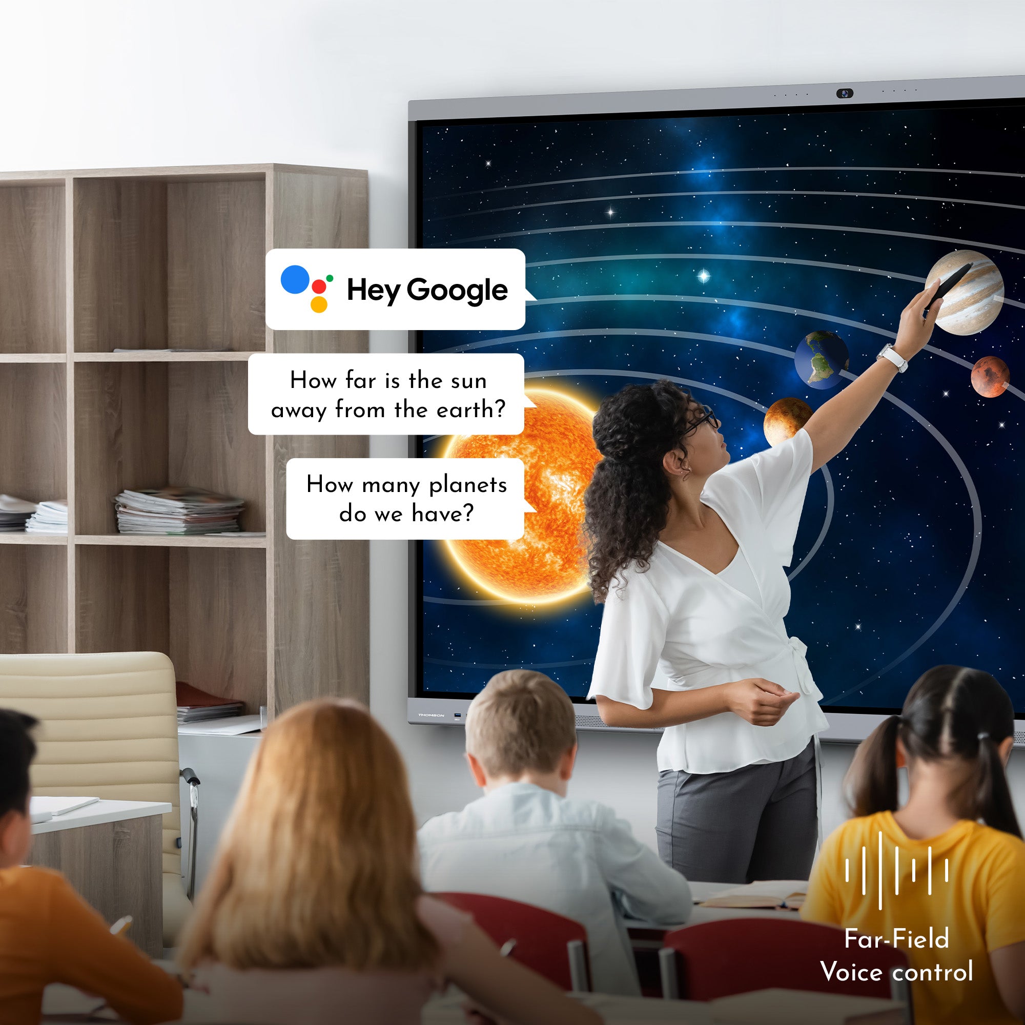 Teacher using a smartboard with a solar system diagram, interacting with students in a classroom setting.
