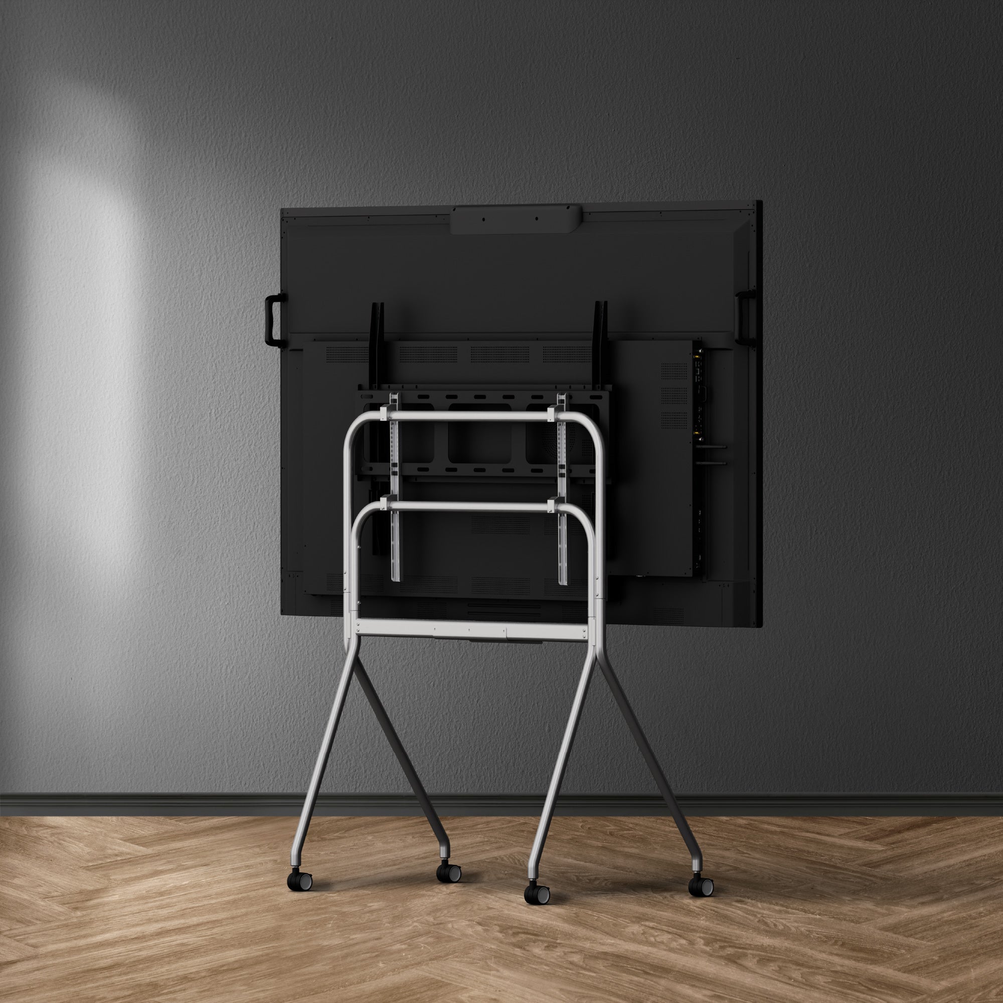 Back view of black Smart Board mounted on a gray metal stand 